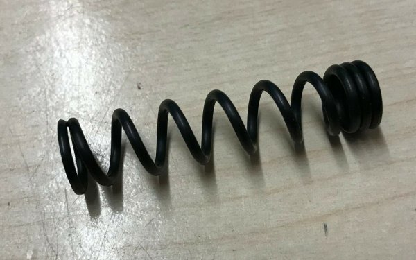 Ejector spring for holesaws